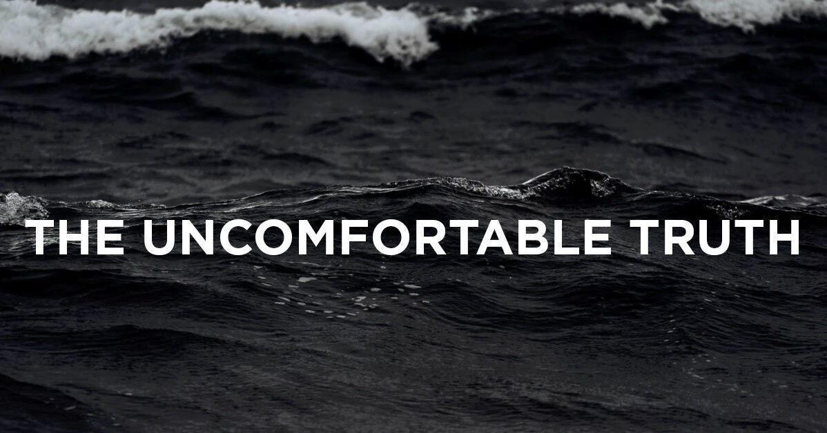 Copy reads, uncomfortable-truth over the top of the waves in the sea